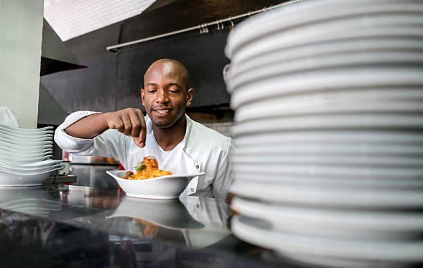 istock Happy chef cooking at a restaurant 506617392