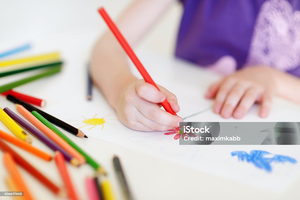 Cute girl drawing a picture with colorful pencils Cute preschooler girl drawing a picture with colorful pencils Crayon Stock Photo