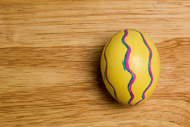 One of Easter Eggs colorful painted on board stock photo