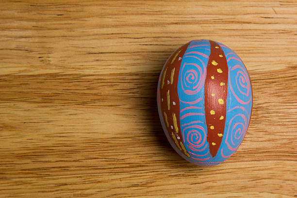 One of Easter Eggs colorful painted on board stock photo