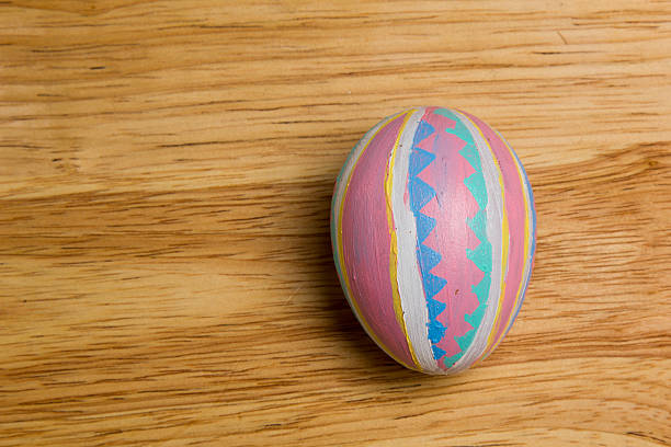 One of Easter Eggs colorful painted on board stock photo