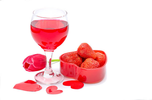 istock Red wine in a glass with fresh strawberries 506619050