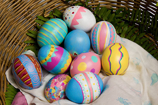 Easter Eggs colorful painted with green fern stock photo