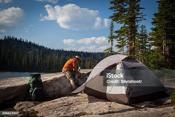 Backpacker Is Starting To Make Dinner On His Stove Stock Photo - Download Image Now