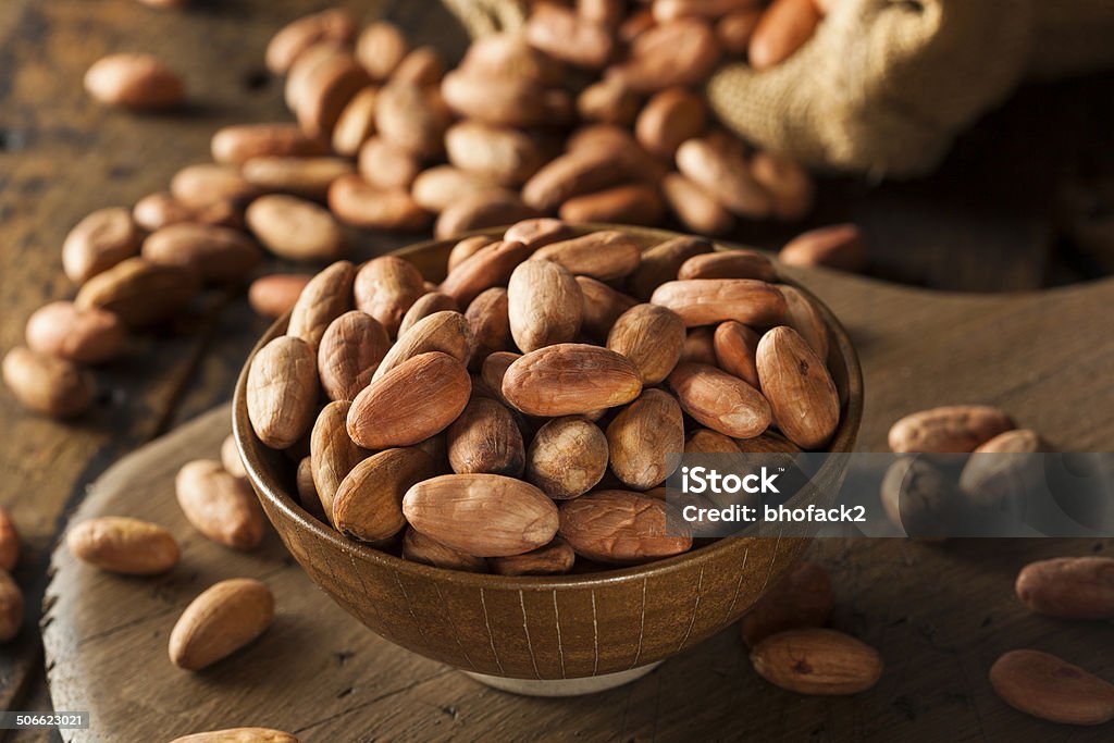 Raw Organic Cocoa Beans Raw Organic Cocoa Beans in a Bowl Bean Stock Photo