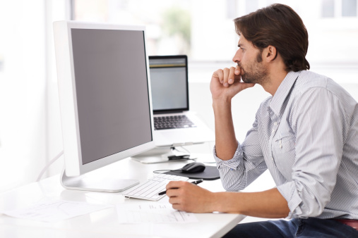 A handsome businessman concentrating on his workload