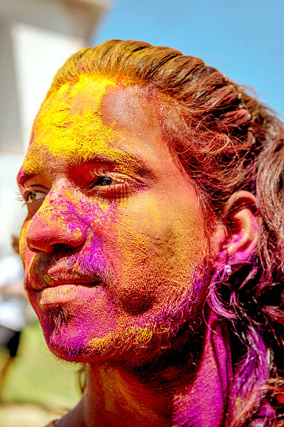 istock Happy indian man celebrating holi 506626639