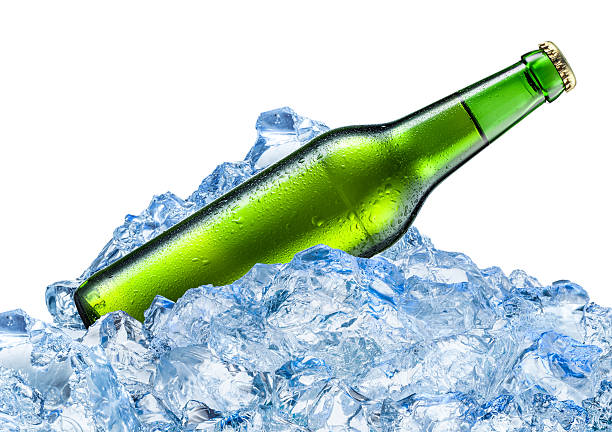 istock Bottle of beer with drops in ice. Isolated on white. 506627631