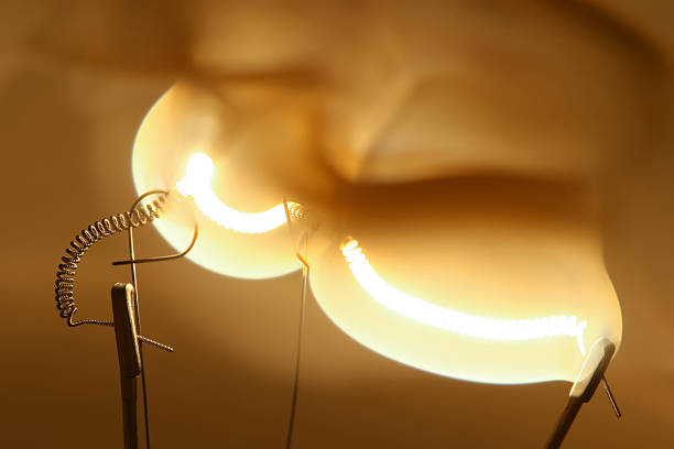 istock Close up glowing light bulb filament 506627763