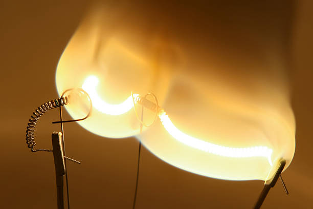 istock Close up of glowing light bulb filament 506627767