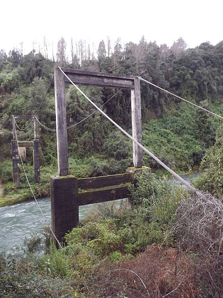 Old bridge to "Huilo Huilo" water falls stock photo