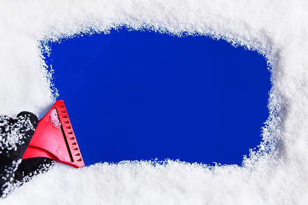 Photo of Ice Scraper on Window