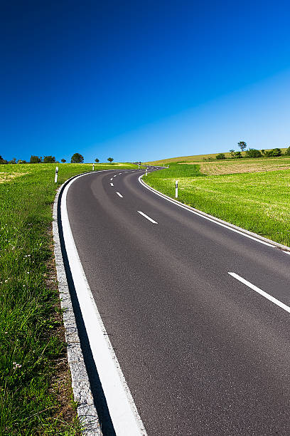 istock Curved empty highway in the beautiful sunny weather 506654583