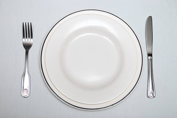 istock silver cutlery, plate on the table 506655093