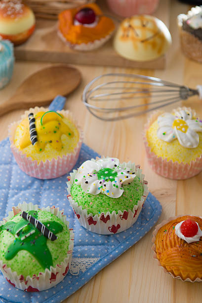 istock cup cakes with a lot of bread pastry background 506660896