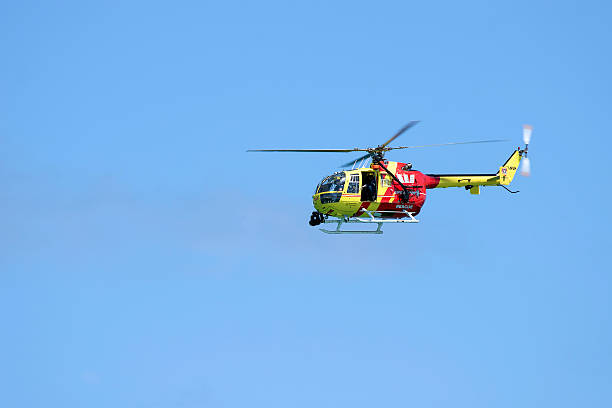 British Coastguard rescue helicopter hovering above __ motion blur on rotor blades