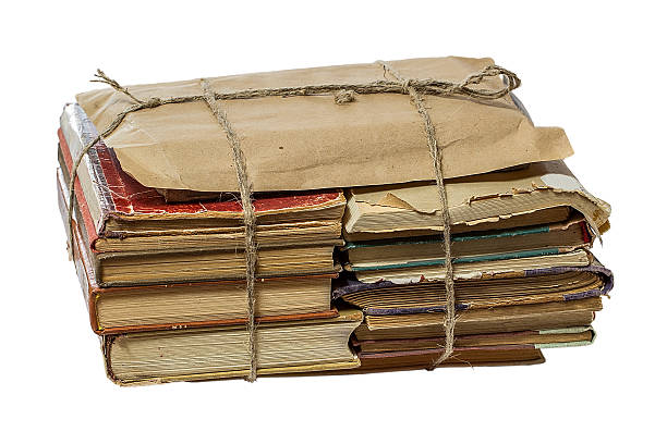 istock stack of  books tied with on white background 506663764