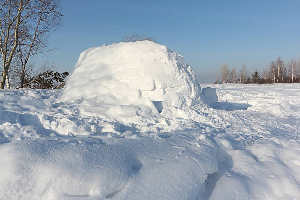 istock Construction an igloo  on a snow glade in the winter 506663998
