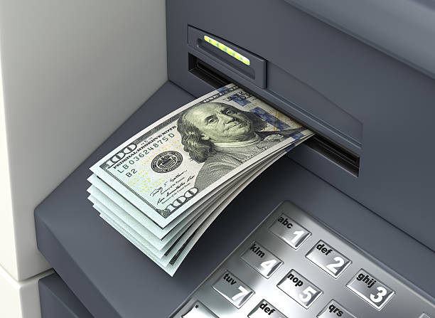 Dollars from ATM Dollars from ATM atm photos stock pictures, royalty-free photos & images