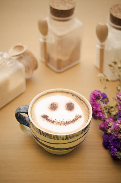 istock hot coffee with foam milk art smile pattern 506665594