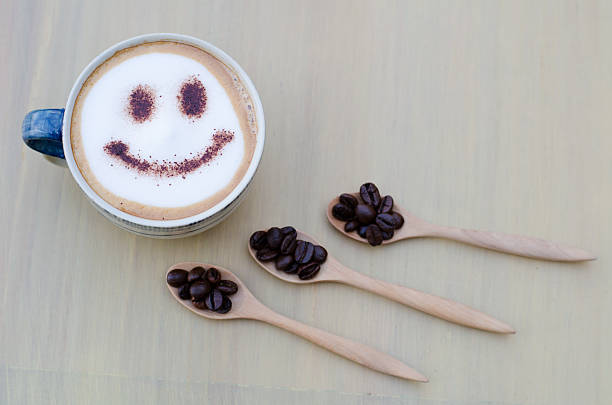 istock hot coffee with foam milk art smile pattern 506665822
