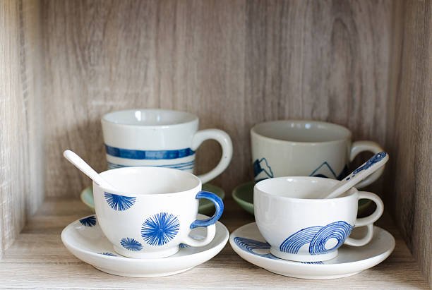 istock Porcelain cup on wooden background 506667362