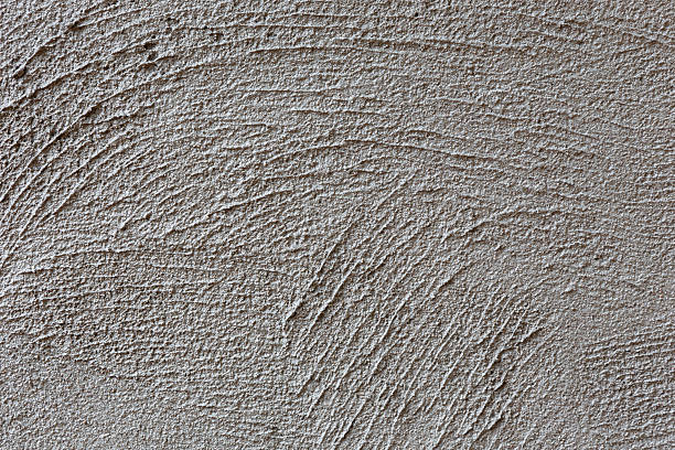 istock plasterer concrete on wall of house construction 506668039