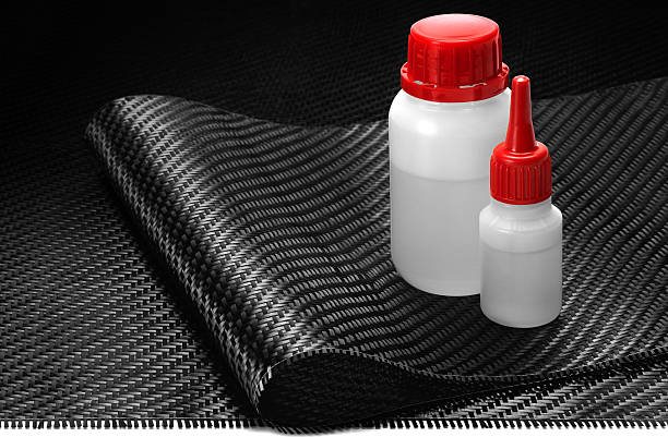 Carbon Fiber Cloth Fabric, epoxy resin and hardener. Carbon Fiber Cloth Fabric, epoxy resin and hardener. hardener stock pictures, royalty-free photos & images