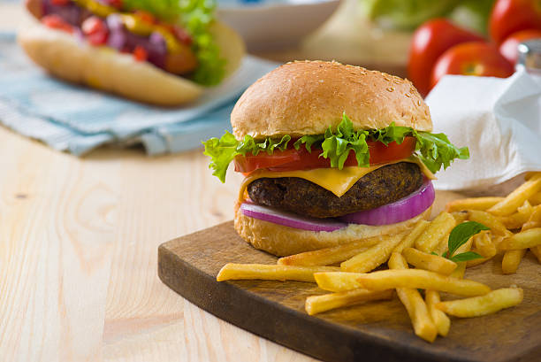 istock burger with fast food items and materials on the background 506669584