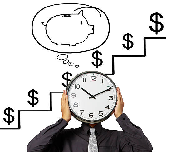 istock Businessman is holding clock  of head 506669652