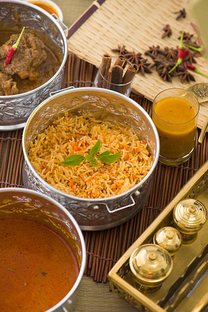 istock Biryani mutton rice papadam with traditional background 506670642