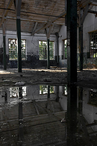 istock old, abandoned factory hall 506670785