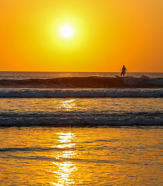 istock Surfing Bali's wave at sunset, Indonesia. 506671866