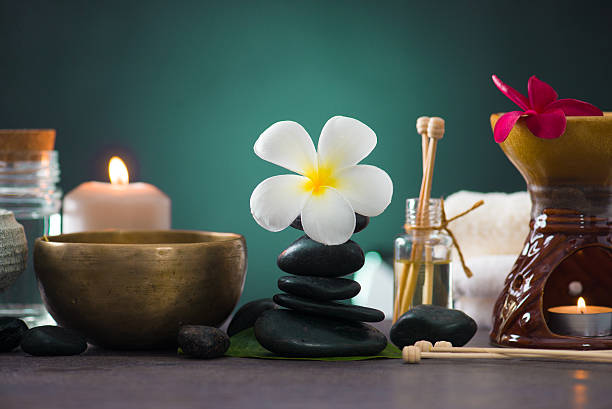 istock Balanced spa stones with green leaves background. 506672926