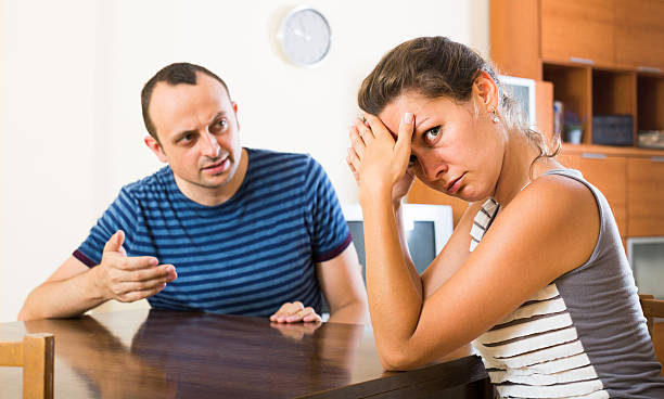 istock family couple shouting while arguing indoors 506674138