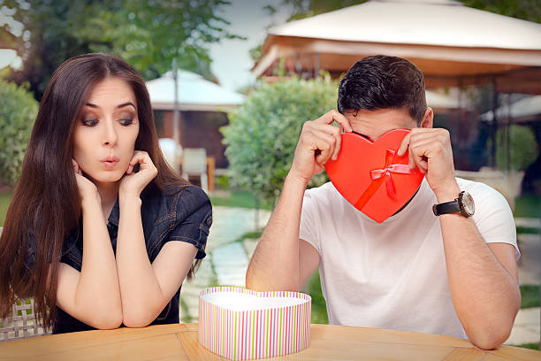 istock Boyfriend Embarrassed with his Valentine Gift 506675678
