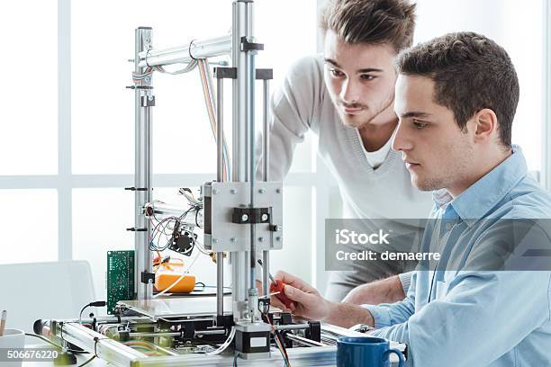 Young Students Using A 3d Printer Stock Photo - Download Image Now - Engineer, Student, Engineering