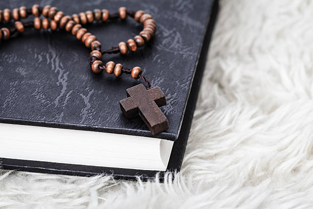 istock Christian cross necklace on Holy Bible book 506676264