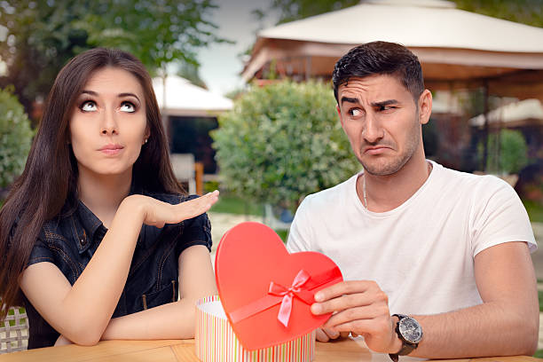 istock Girl Refusing Heart Shaped Gift From Her Boyfriend 506676556