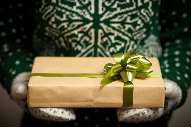 istock Girl holding a Christmas gift 506677804