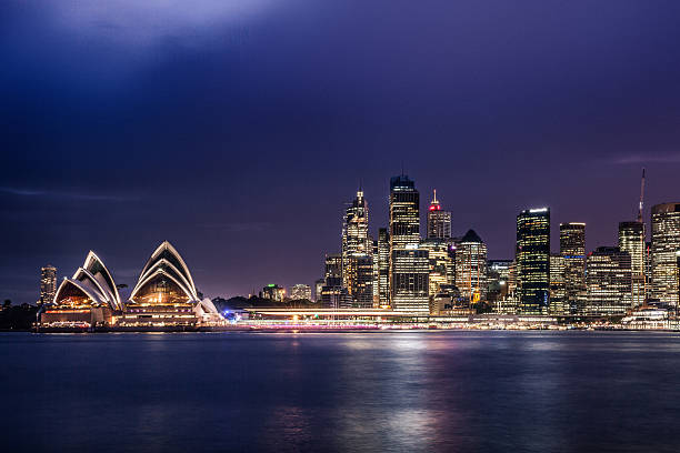 istock Sydney CBD and harbor illuminated at night 506678670