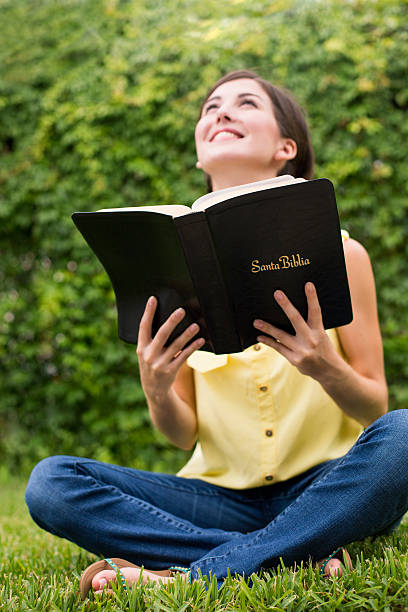 istock Latin woman in prayer 506688743