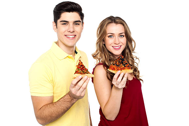 istock Young lovers posing with pizza slice in hand 506689383
