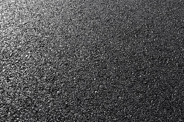 istock close-up horizontal view of new asphalt road 506689513