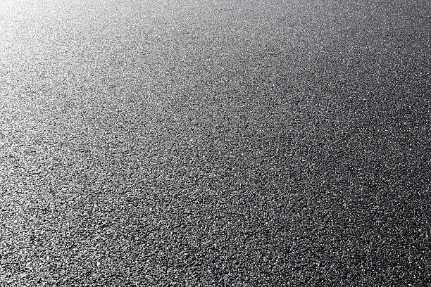 istock close-up horizontal view of new asphalt road 506689543