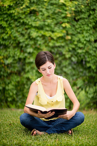 istock Latin woman reading bible 506689867