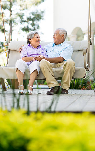istock Senior couple smiling at each other 506689873