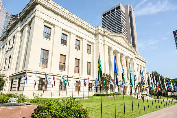 Ohio Statehouse Lawn Adorned With Ohio's County Flags The Ohio Statehouse in Columbus, Ohio, is one of the finest examples of Greek Revival architecture in the United States. Ohio's 88 county flags are flown at the Statehouse on special occassions throughout the year. ohio ohio statehouse columbus state capitol building stock pictures, royalty-free photos & images