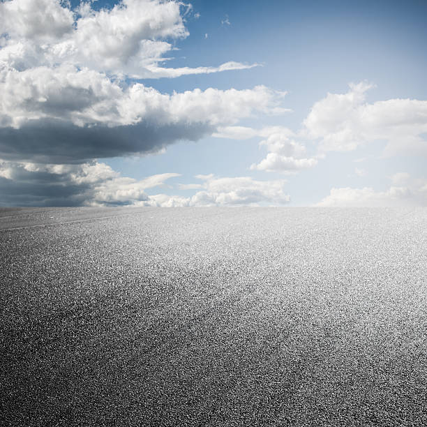 istock close-up horizontal view of new asphalt road 506690835