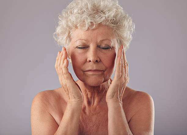 istock Old woman touching her face 506692087